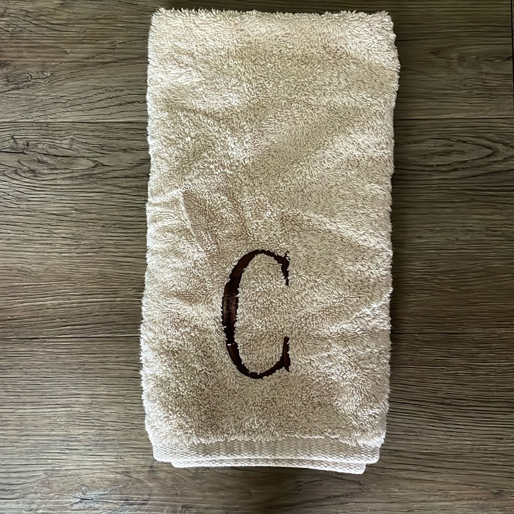 avanti 100% cotton “C” tan hand towel